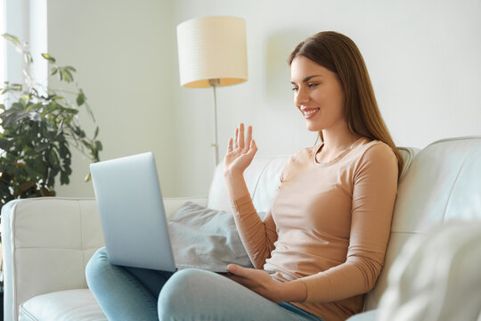 Young millennial teenager woman using laptop for videocall virtual meeting - Powered by Adobe