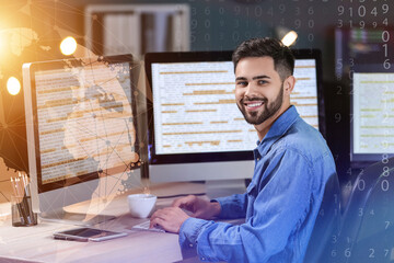 Portrait of male programmer working in office