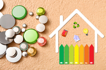 Many lithium batteries and drawing of house with energy efficiency rating on color background