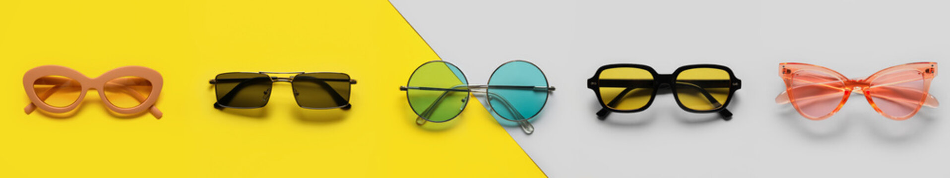 Set of different stylish sunglasses on color background
