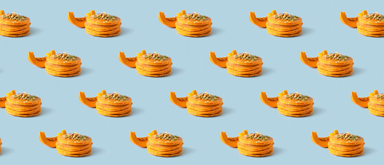 Tasty pumpkin pancakes on grey background