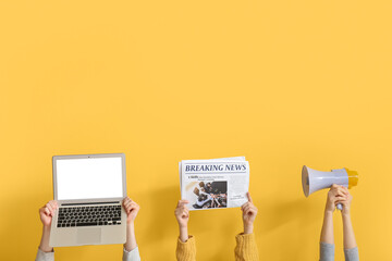 People with newspaper, laptop and megaphone on yellow background