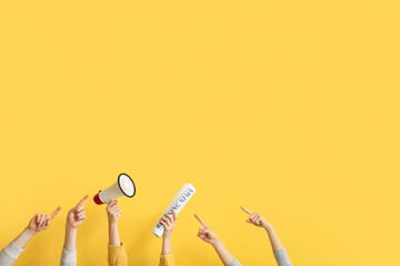 People pointing at megaphone and newspaper on yellow background