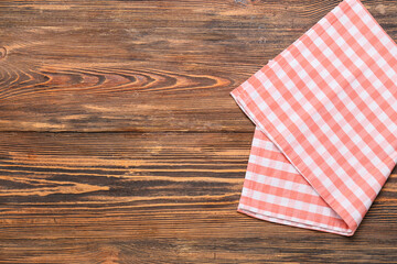 Obraz premium New checkered napkin for picnic on wooden background