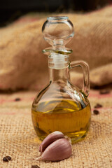 Olive oil with some garlic placed on vegetable fiber