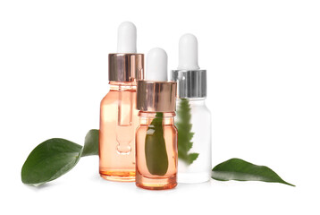 Bottles of natural serum and plant leaves on white background