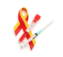 Awareness ribbon with blood sample and syringe on white background. Hepatitis concept