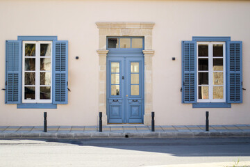 Beautiful blue door with windows in old building in Cyprus