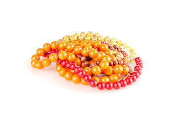 Various multi-colored necklaces on a white background isolated. 