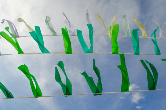 Sakha "salama" decoration. White blue and green ribbons against the sky