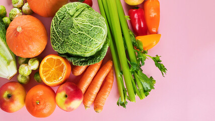 Assortment of vegetables and fruits on colorful background.