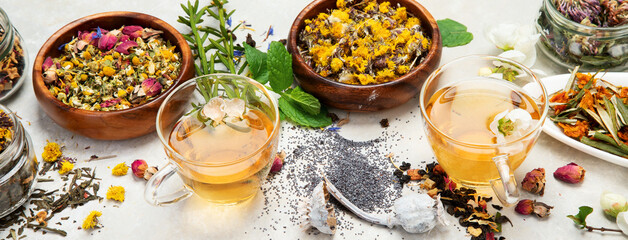 Herbal tea assortment on dark background.