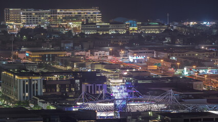 City Walk district night timelapse from above, new urban area in Dubai downtown.
