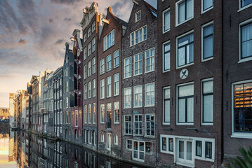 Obraz premium Amsterdam City Scene, typical dutch houses and their reflection in the canal.