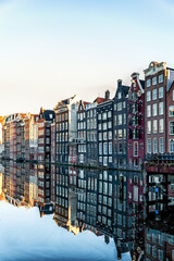 Amsterdam City Scene,  typical dutch houses and their reflection in the canal.