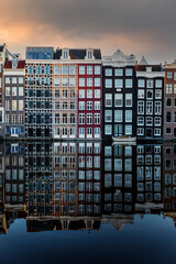 Amsterdam City Scene,  typical dutch houses and their reflection in the canal.