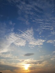 potrait sunset view with blue sky and cirrus cloud