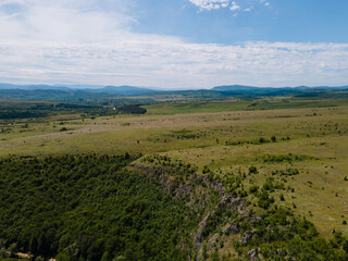 Landscape of green mountain hill and blue sky with white clouds