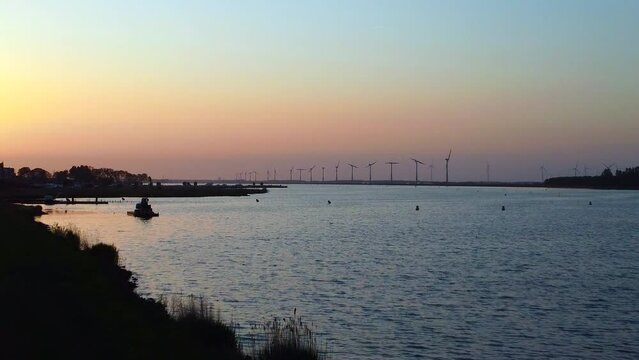Evening sunset with wind turbines at Bunschoten-Spakenburg, The Netherlands