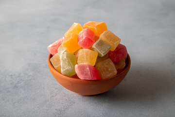 Traditional Turkish delight in bowls. Colorful Turkish delight on texture background

