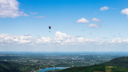 Paraglider in the sky. view from the top of Żar in the Beskid Mały.