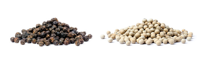 Pile of black and white pepper seeds (peppercorns) isolated on white background.