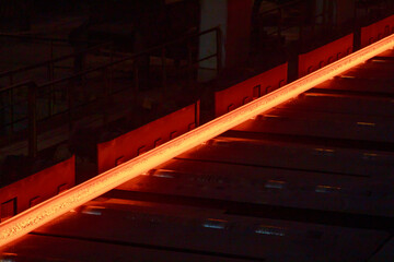 Hot steell billet on rolling mill.