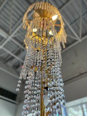 Vintage decorative chandelier in the room. Interior decorated with crystalline chandelier