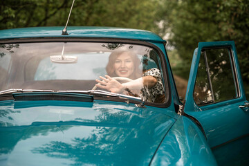 photoshoot in retro style red-haired girl and car