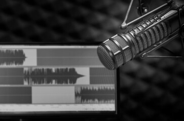 Background with a professional microphone and wave form on screen