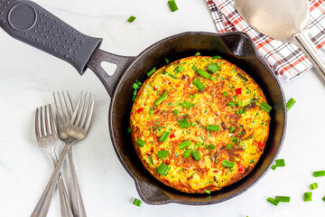 Frittata Made of Eggs in Cast Iron Pan Top Down Photo
