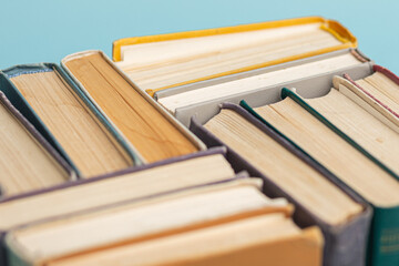 Old books on wooden table close-up, top view. World Book Day poster. Education concept