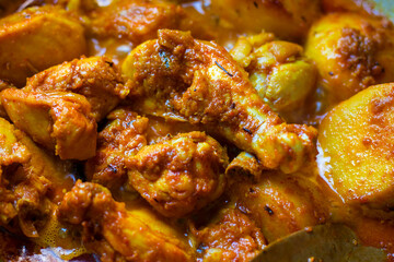 selective focus of delicious Indian chicken curry in Bengali style.
