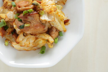 Chinese food, cabbage and chicken stir fried with spicy sauce