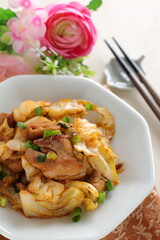 Chinese food, cabbage and chicken stir fried with spicy sauce
