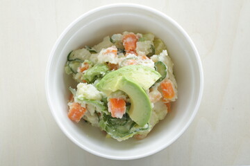 Avocado and carrot mixed mayonnaise salad  with copy space
