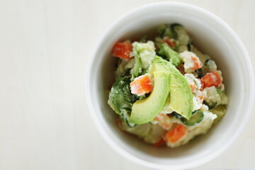 Avocado and carrot mixed mayonnaise salad  with copy space