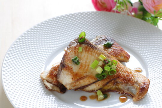 Japanese style fried Yellowtail fish with teriyaki sauce for comfort food image