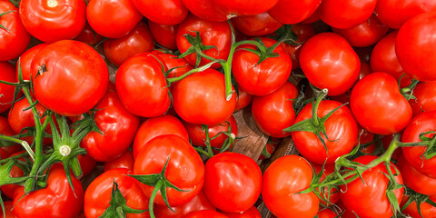 tomato  green branch cherry tomatoes fruit market store healthy meal food diet snack on the table copy space food background rustic top view keto or paleo diet veggie vegan