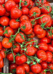 tomato  green branch cherry tomatoes fruit market store healthy meal food diet snack on the table copy space food background rustic top view keto or paleo diet veggie vegan