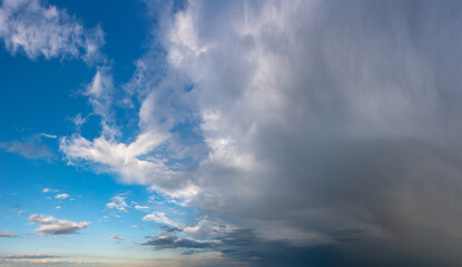 Fototapeta na wymiar Fantastic soft thunderclouds, sky panorama