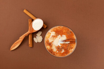 Glass of Salep or Sahlep, top view. Selective focus. Salep - Turkish traditional drink with cinnamon