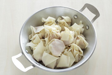 Chinese food ingredient, homemade wonton in stainless steel pan
