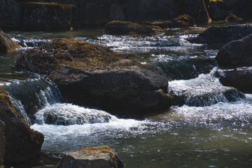 small stream that was artificially created with a small waterfall