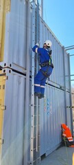 Delegates do practical exercises during a training session on working at height