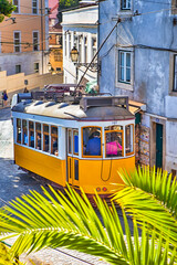 Fototapeta na wymiar Portugal travel Destinations. Portuguese Tram as Famous National City Tourist Attraction Traveling Across The City Inside Lisbon