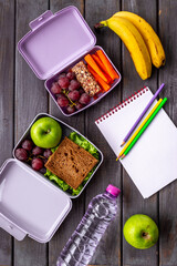 School lunch boxes filled with fruits and vegetables. Healthy meal