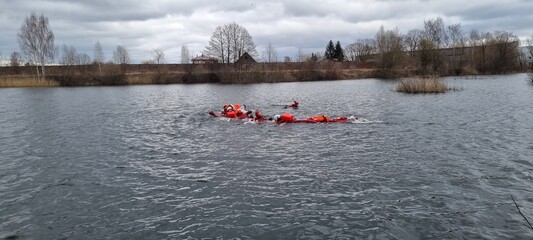 Delegates do practical exercises during a training session on Sea Survival