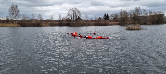 Delegates do practical exercises during a training session on Sea Survival