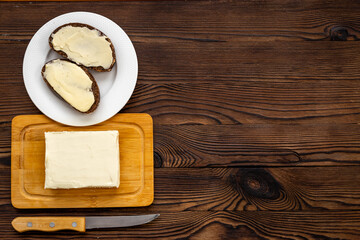 Slice of bread with butter, top view. Sandwiches with butter